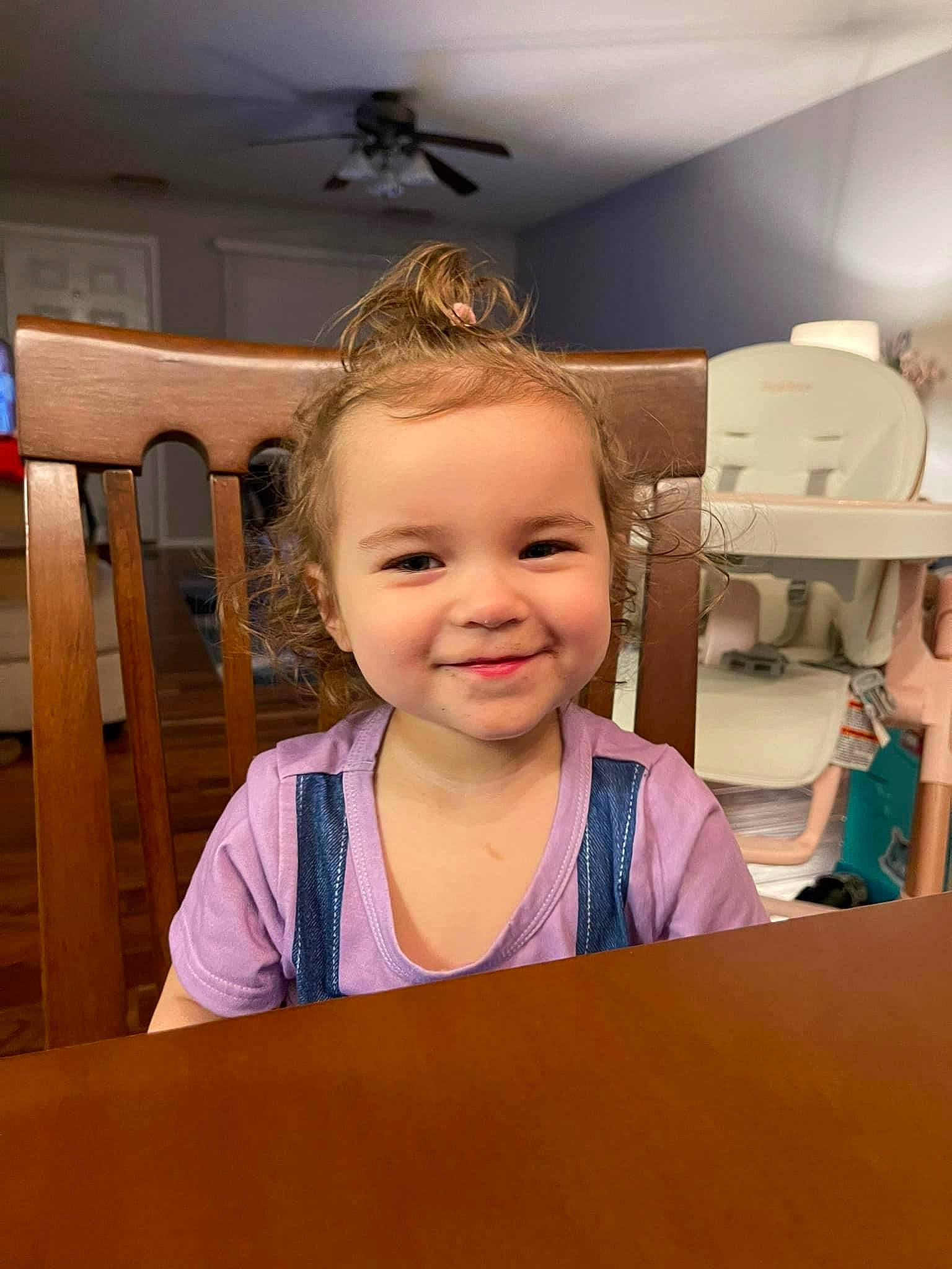 Julianna joined the competition — help win amazing prizes! baby, blond, ceiling, ceiling_fan, chair, child, flooring, fun, happy, joy, laugh, mechanical_fan, person, refrigerator, room, sitting, smile, standing, t_shirt, table