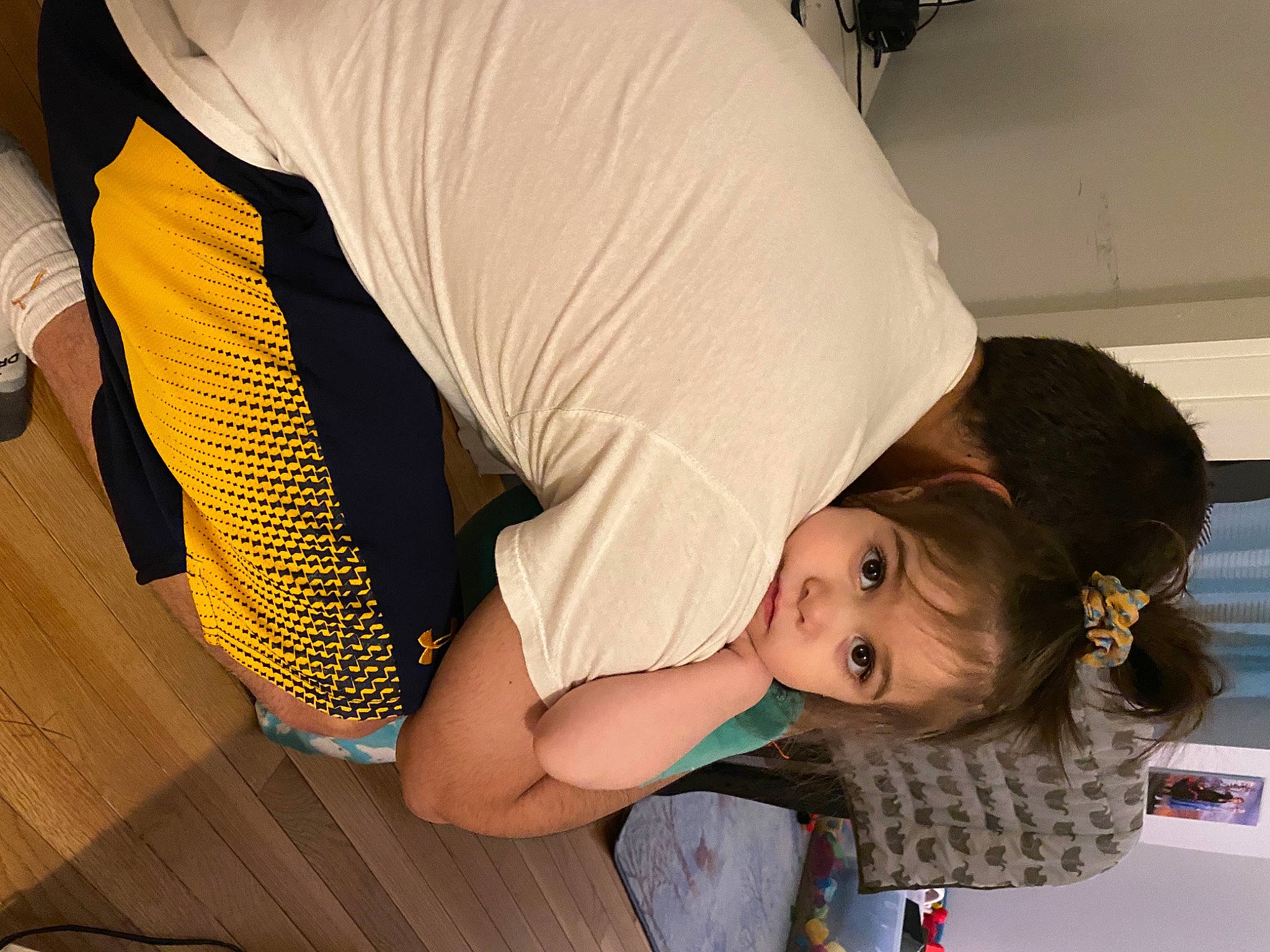 Cleo is registered to the contest to win money with this photo: abdomen, child, comfort, elbow, flooring, fun, gesture, happy, human_leg, joint, knee, leg, leisure, person, sitting, smile, t_shirt, thigh, toddler, trunk