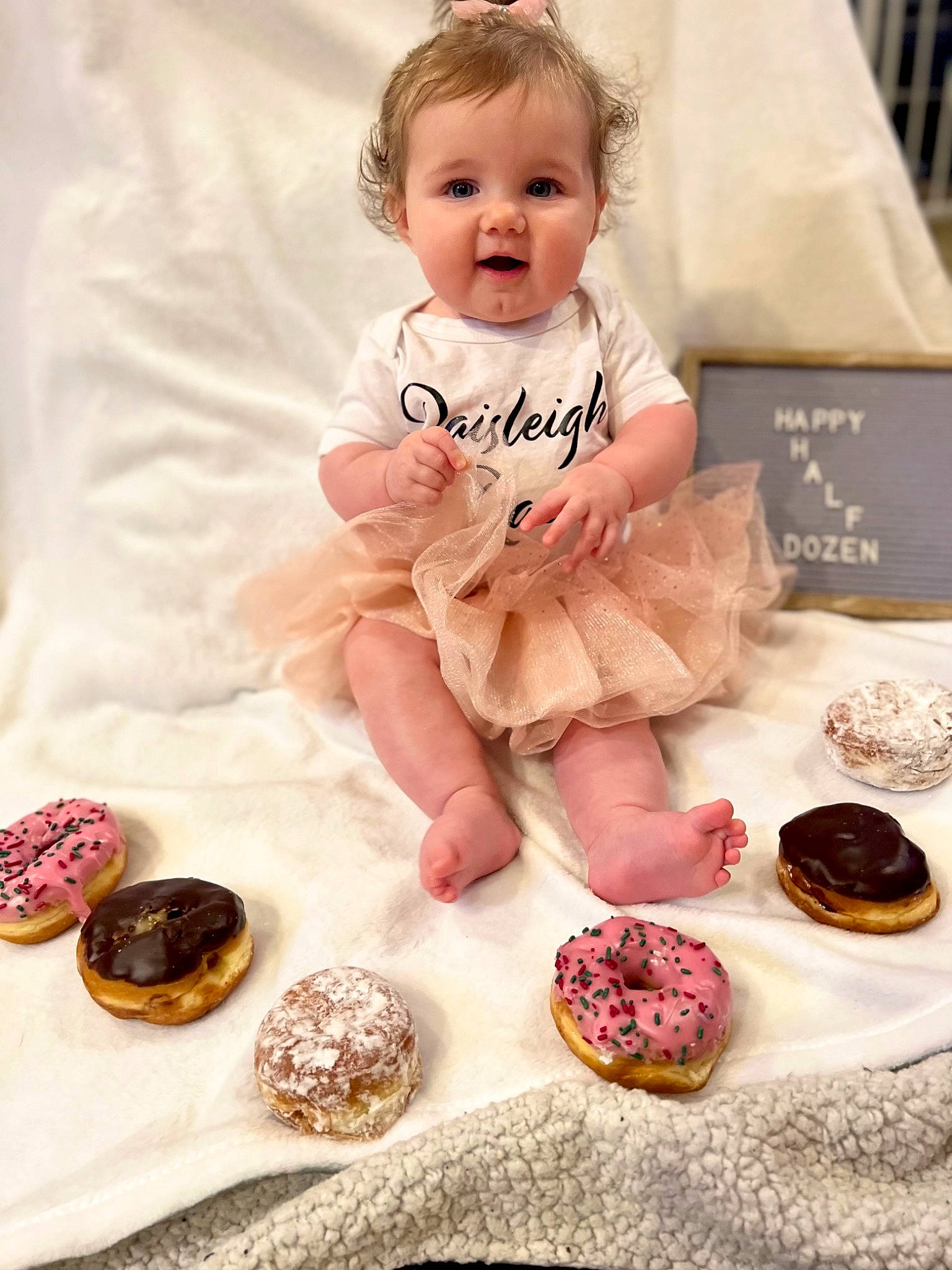 Paisleigh is registered to the contest to win money with this photo: baby, baby_toddler_clothing, baking, beauty, cheek, child, cuisine, dessert, dish, dress, hand, happy, person, pink, recipe, sitting, skin, sleeve, smile, sweetness