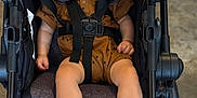 Easton joined the competition — help win amazing prizes! baby, sleeping, stroller, infant, child, brown_outfit, footwearless, seatbelt, relaxed, indoor, cute, peaceful, toddler, headrest, soft_lighting, black_stroller, small_child, hands, legs, nap