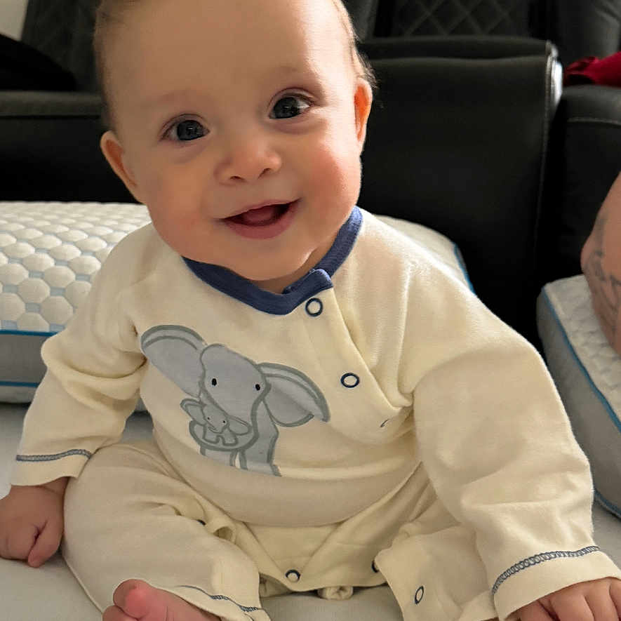 Angel Adriel Leal joined the competition — help win amazing prizes! architecture, baby, bodypart, building, couch, cushion, face, finger, furniture, hand, happy, head, homedecor, indoors, livingroom, person, photography, portrait, room, sitting