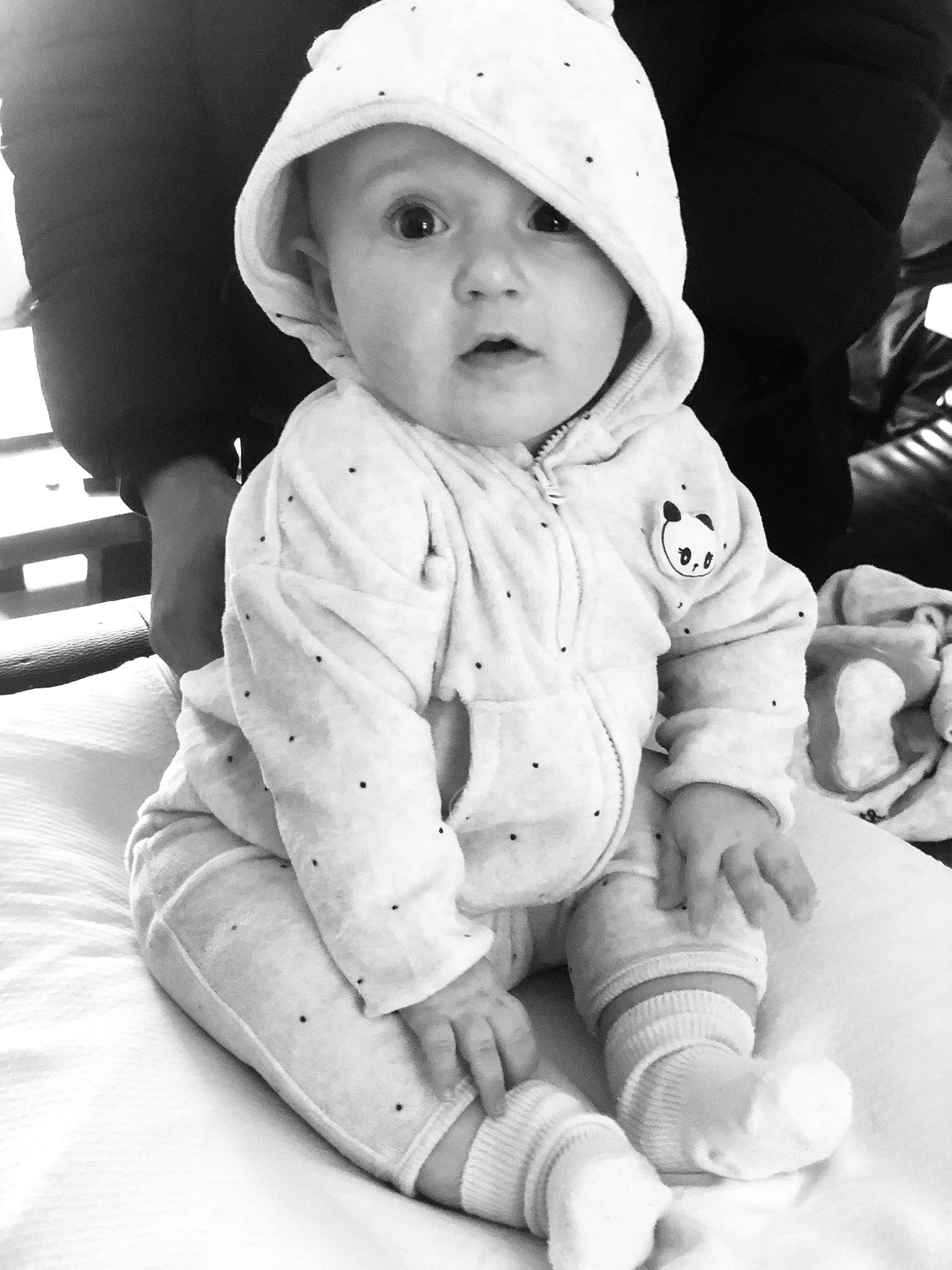 Milla participe au concours pour gagner de l'argent avec cette photo : baby, baby_toddler_clothing, black, black_and_white, cap, cheek, child, comfort, eye, facial_expression, fun, happy, head, headgear, headwear, person, photograph, skin, sleeve, snapshot