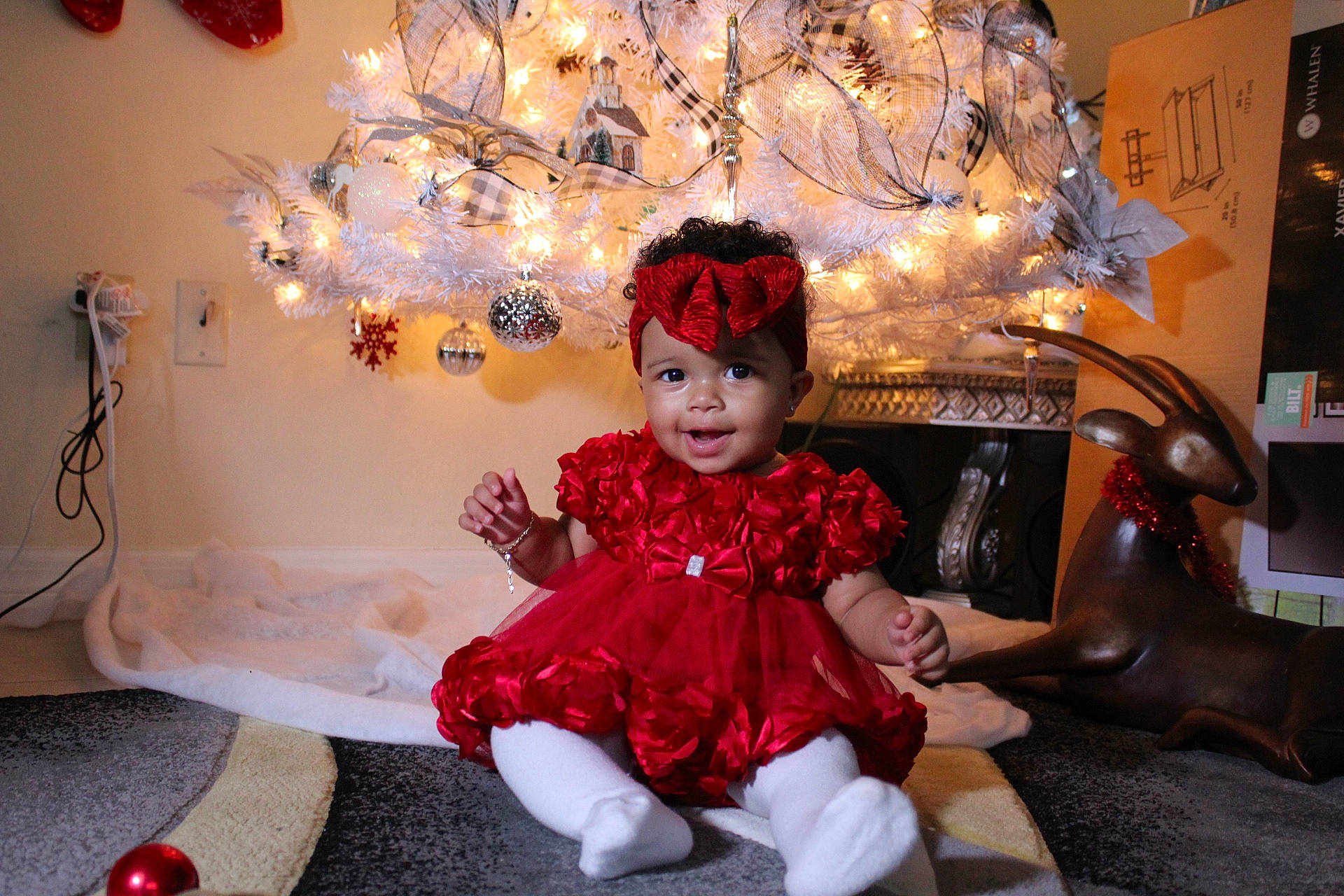 Sienna is registered to the contest to win money with this photo: baby_toddler_clothing, child, christmas, christmas_eve, costume, decoration, embellishment, event, fun, happy, hat, headpiece, headwear, holiday, magenta, party, person, pink, room, smile
