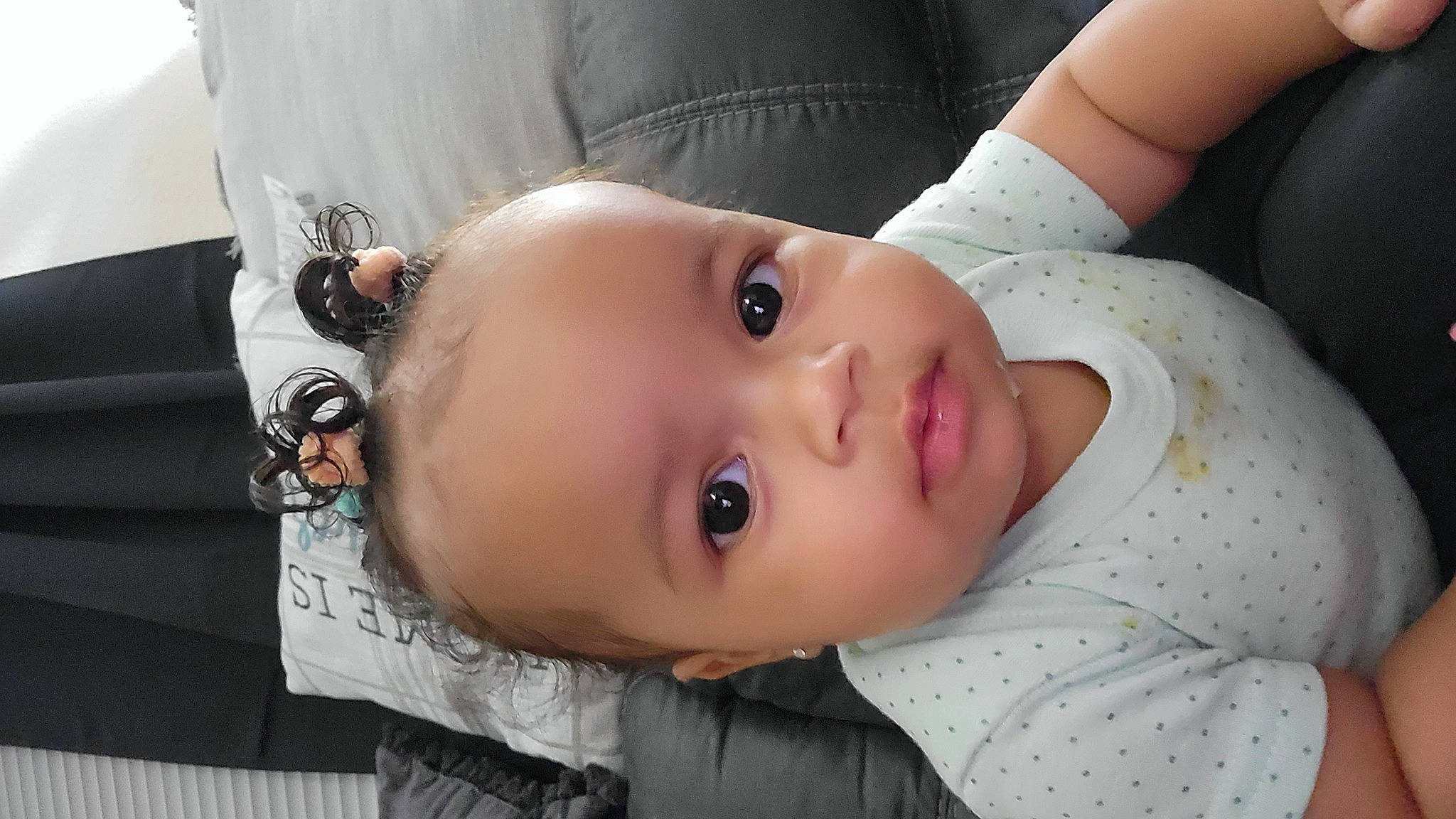 Sienna is registered to the contest to win money with this photo: baby, baby_toddler_clothing, cheek, child, chin, comfort, eyebrow, eyelash, flash_photography, happy, iris, lip, mouth, neck, nose, person, portrait_photography, sitting, skin, sleeve