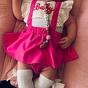 Lyla participe au concours pour gagner de l'argent avec cette photo : baby, child, closeup, clothing, comfortable, cushion, cute, head_wrap, heart_pattern, indoors, infant, knee_socks, pacifier, pacifier_clip, pink_skirt, portrait, shoes, smiling, soft_fabric, white_top
