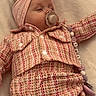 Lyla a rejoint le concours — aidez-le/la à gagner de superbes lots ! accessory, baby, blanket, child, clothing, cute, fabric, headband, indoor, infant, pacifier, peaceful, pink, plaid, portrait, resting, sleeping, soft, toddler, wear