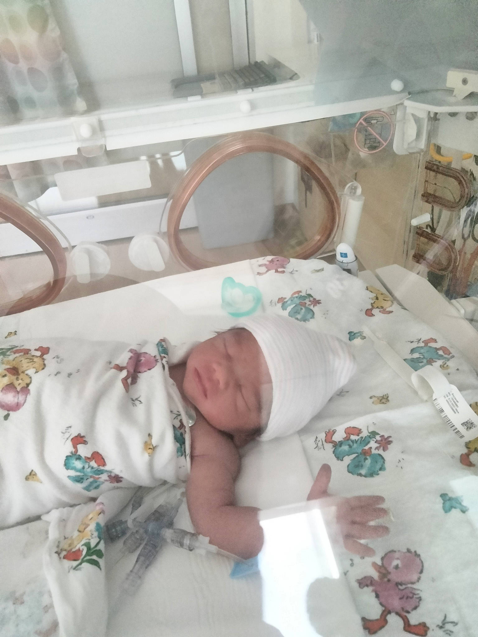 Ahmed is registered to the contest to win money with this photo: baby, baby_products, baby_safety, baby_toddler_clothing, bed, bed_sheet, bedding, child, comfort, event, headwear, health_care, hospital, hospital_bed, linens, medical, medical_equipment, patient, person, room