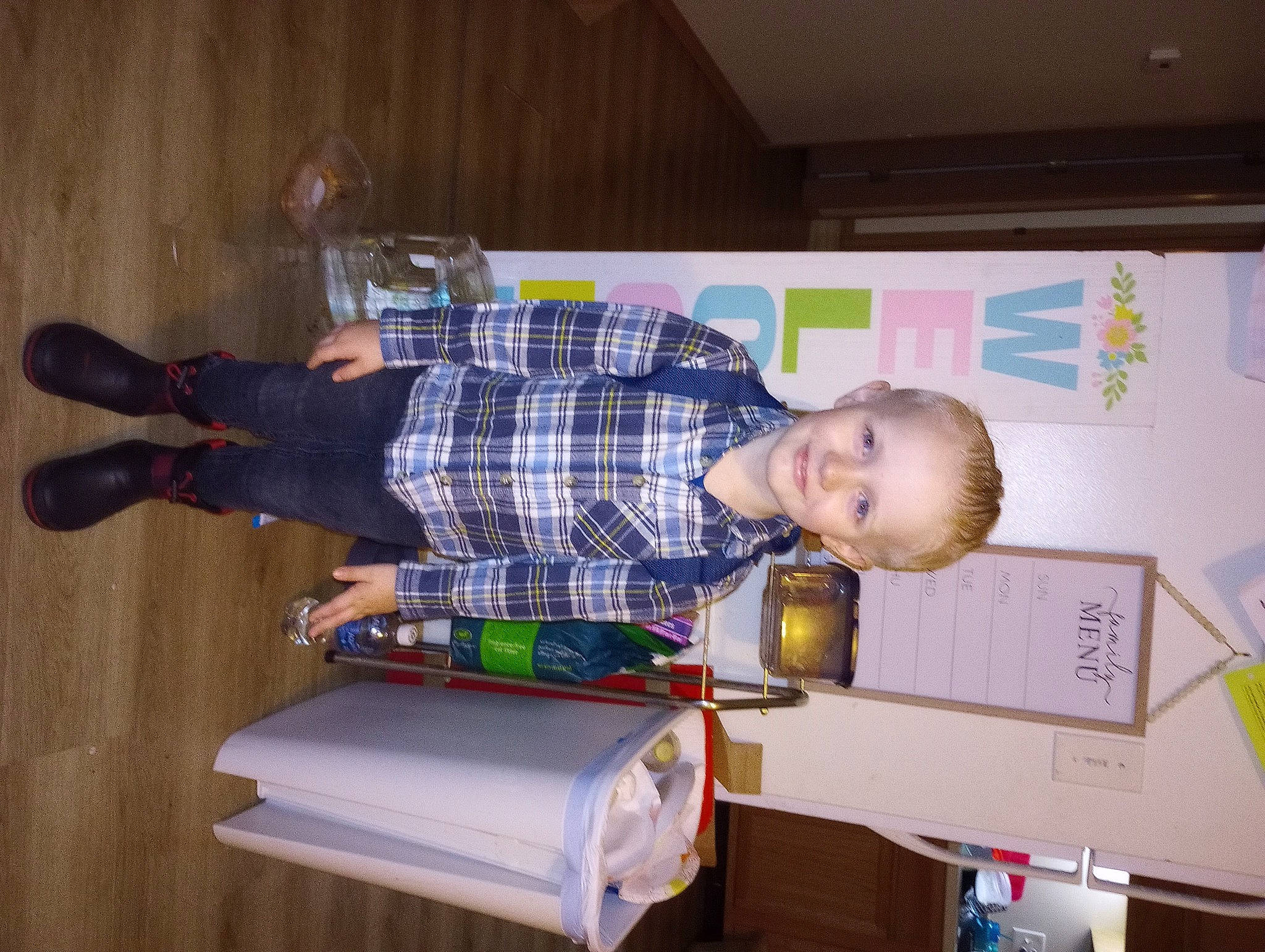 Jax joined the competition — help win amazing prizes! baby, baby_toddler_clothing, child, comfort, flooring, hardwood, human_leg, joy, knee, machine, person, room, shipping_box, sitting, smile, sock, t_shirt, tartan, toddler