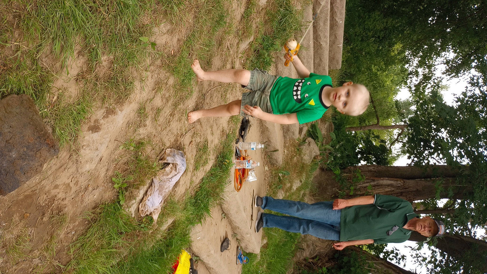 Jax is registered to the contest to win money with this photo: adventure, fun, grass, happy, headwear, landscape, leisure, people_in_nature, person, plant, recreation, shorts, soil, t_shirt, tree, wood