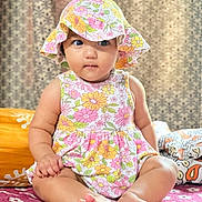 Krisha joined the competition — help win amazing prizes! baby, bed, bedroom, bonnet, cap, clothing, couch, cushion, dress, face, furniture, hat, head, homedecor, indoors, person, photography, portrait, sitting, sunhat