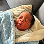 newborn, baby, blanket, blue_blanket, cozy, couch, soft_texture, sleeping, infant, wrapped, face, peaceful, resting, indoors, child, cute, portrait, warm, comfort, person