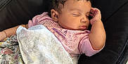Aurora is registered to the contest to win money with this photo: baby, baby_seat, blanket, child, comfort, cozy, curly_hair, cute, floral_pattern, indoor, infant, napping, peaceful, person, pink_shirt, portrait, relaxing, resting, sleeping, soft
