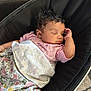 baby, baby_seat, blanket, child, comfort, cozy, curly_hair, cute, floral_pattern, indoor, infant, napping, peaceful, person, pink_shirt, portrait, relaxing, resting, sleeping, soft