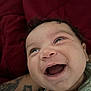 Aurora joined the competition — help win amazing prizes! baby, child, smiling, laughing, face, curly_hair, tattoo, arm, closeup, red_background, joyful, happy, person, infant, skin, mouth_open, expression, young_child, indoor, casual