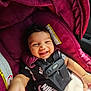 baby, black_clothing, blanket, car, car_seat, child, child_safety, cute, fabric, happy, head_support, indoor, infant, nike_shirt, seat, seat_belt, smiling, straps, toddler, young_child