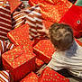 Pauline participe au concours pour gagner de l'argent avec cette photo : baby, celebration, child, crawling, festive, floor, gift_wrap, gold_stars, hair, hands, head, holiday, indoor, plush_toy, presents, red_wrapping_paper, striped_wrapping_paper, toddler, toy, white_clothing
