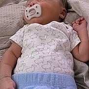 Enzo joined the competition — help win amazing prizes! baby, sleeping, pacifier, onesie, sheep_pattern, blanket, blue_blanket, bed, cozy, infant, child, cute, peaceful, resting, toddler, soft, fabric, home, indoors, person