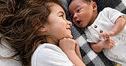 Enzo joined the competition — help win amazing prizes! baby, blanket, bonding, child, closeup, cozy, curly_hair, expression, face, family_moment, happy, indoors, infant, looking_at_each_other, lying_down, newborn, skin, smiling, toddler, white_shirt