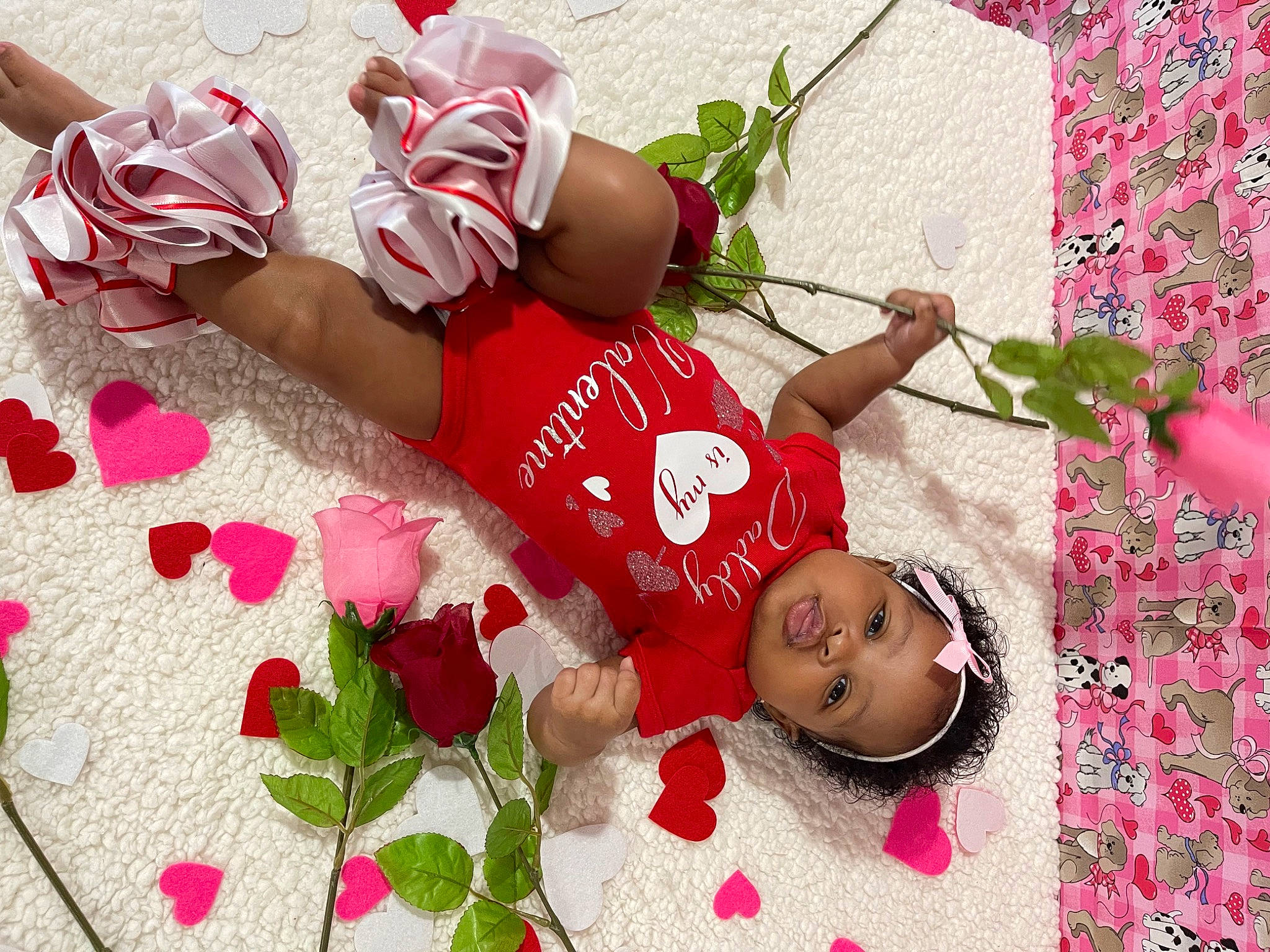 Imani is registered to the contest to win money with this photo: baby, baby_toddler_clothing, carmine, child, event, flower, happy, headwear, leaf, leisure, pattern, people_in_nature, person, petal, pink, plant, product, red, textile, thigh