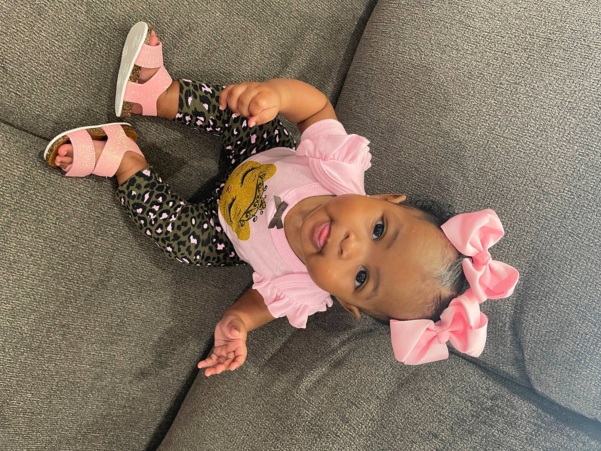 Imani joined the competition — help win amazing prizes! baby, baby_products, baby_toddler_clothing, child, comfort, facial_expression, fashion_accessory, flooring, hat, headgear, linens, pattern, person, pink, room, skin, sleeve, sock, toddler, vertebrate