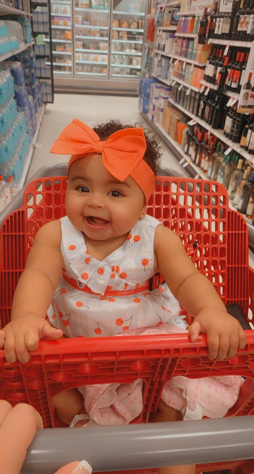 Janaya is registered to the contest to win money with this photo: baby, baby_products, baby_toddler_clothing, baseball_cap, cap, child, facial_expression, fashion_accessory, fun, happy, headwear, joy, pattern, person, pink, shelf, shelving, sitting, skin, sleeve
