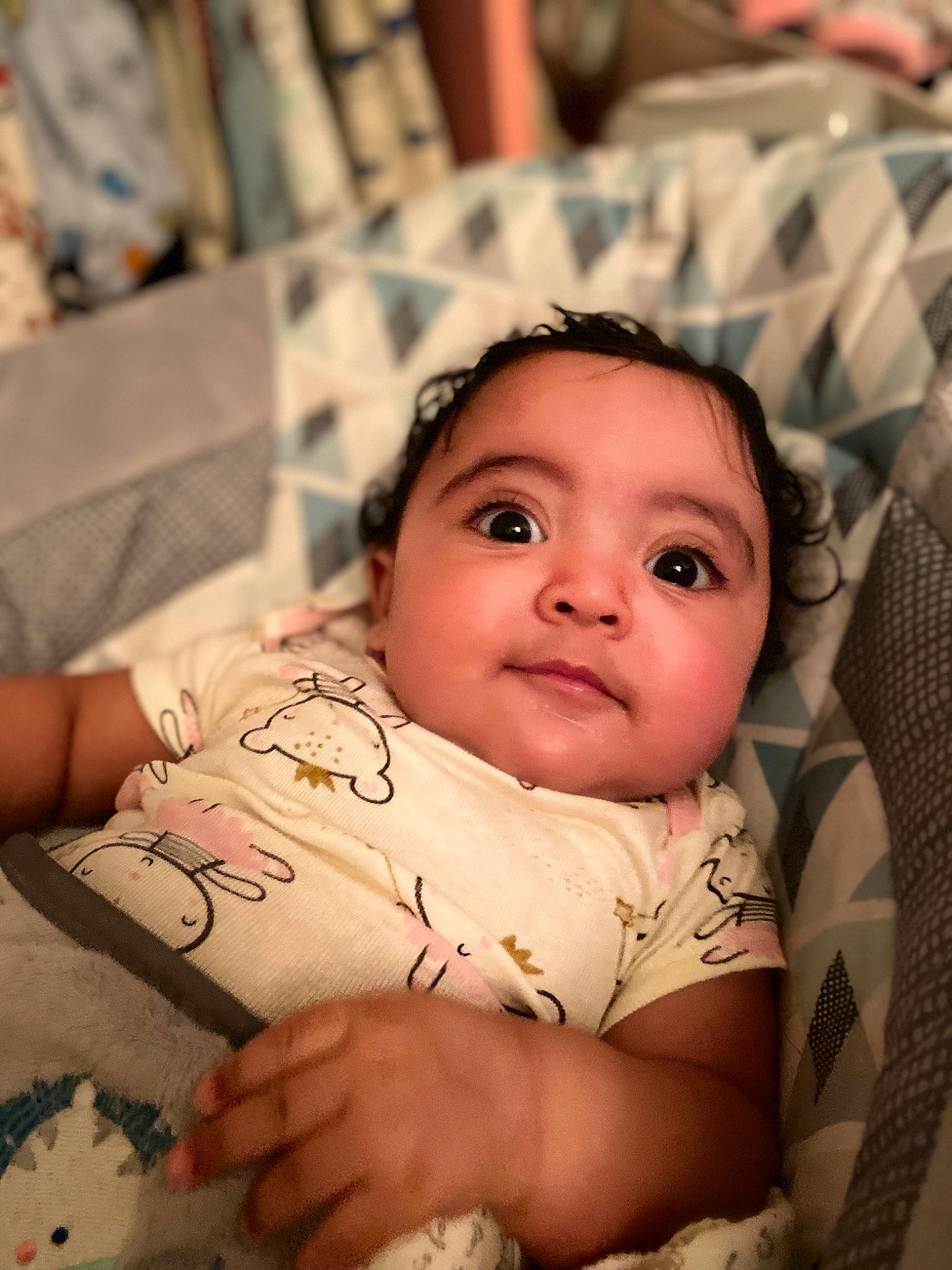 Naia is registered to the contest to win money with this photo: baby, baby_toddler_clothing, cheek, chin, comfort, eye, eyebrow, eyelash, finger, forehead, happy, iris, linens, lip, mouth, neck, nose, person, skin, textile