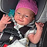 Lilie is registered to the contest to win money with this photo: baby, infant, child, car_seat, pink_hat, smiling, face, hands, pacifier, pacifier_clip, blanket, clothing, portrait, sitting, vehicle, safety_harness, indoor, close_up, newborn, happy