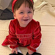 Olivia-Jane a rejoint le concours — aidez-le/la à gagner de superbes lots ! toddler, child, smiling, red_dress, headband, black_shoes, sitting, bedspread, indoor, cute, happy, portrait, baby, person, fashion, clothing, footwear, cozy, blanket, young_child