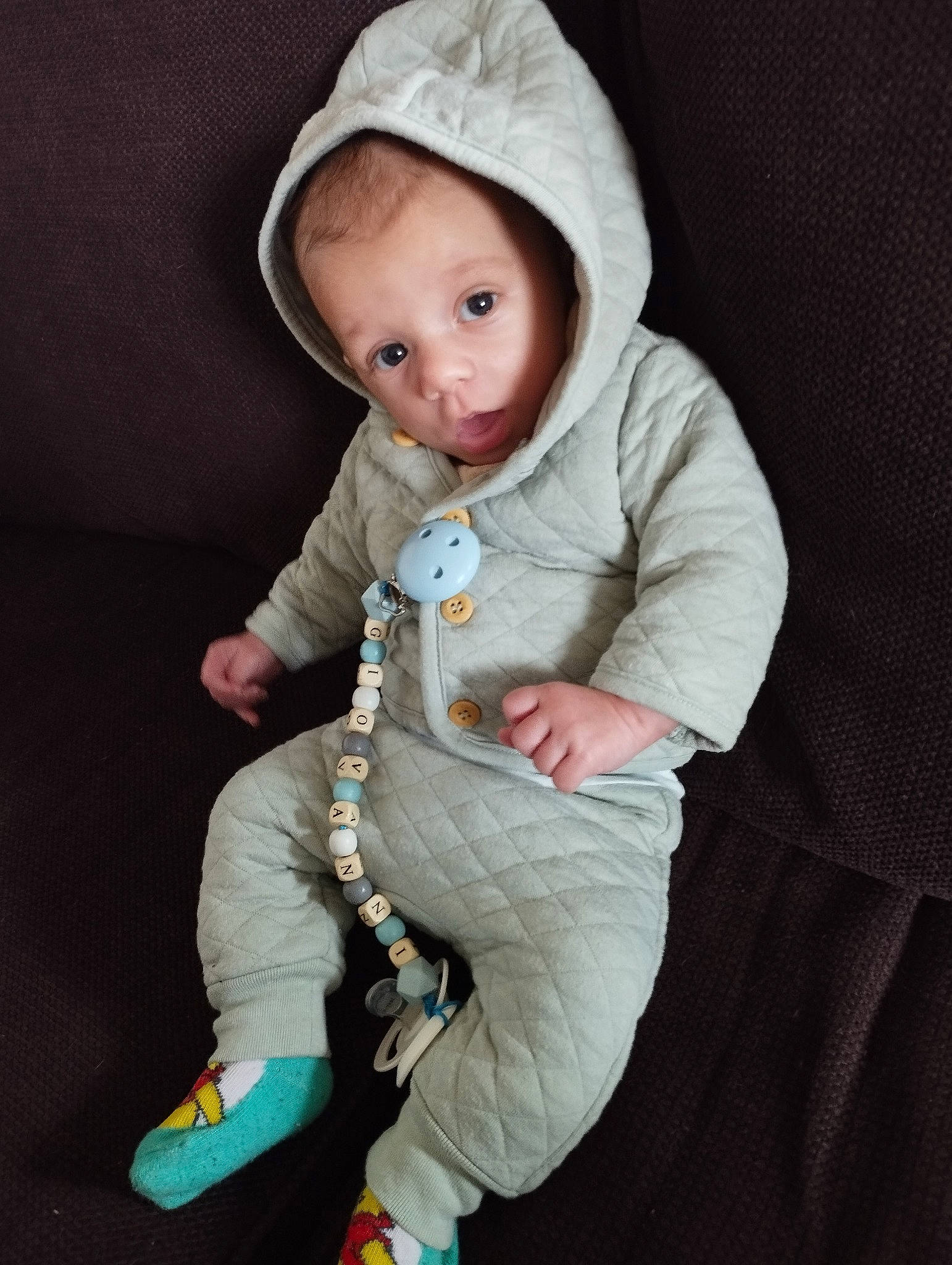 Giovanni a rejoint le concours — aidez-le/la à gagner de superbes lots ! arm, baby, baby_products, baby_toddler_clothing, cap, cheek, child, cool, doll, face, fashion_accessory, fur, hand, hood, organ, outerwear, person, sitting, skin, sleeve