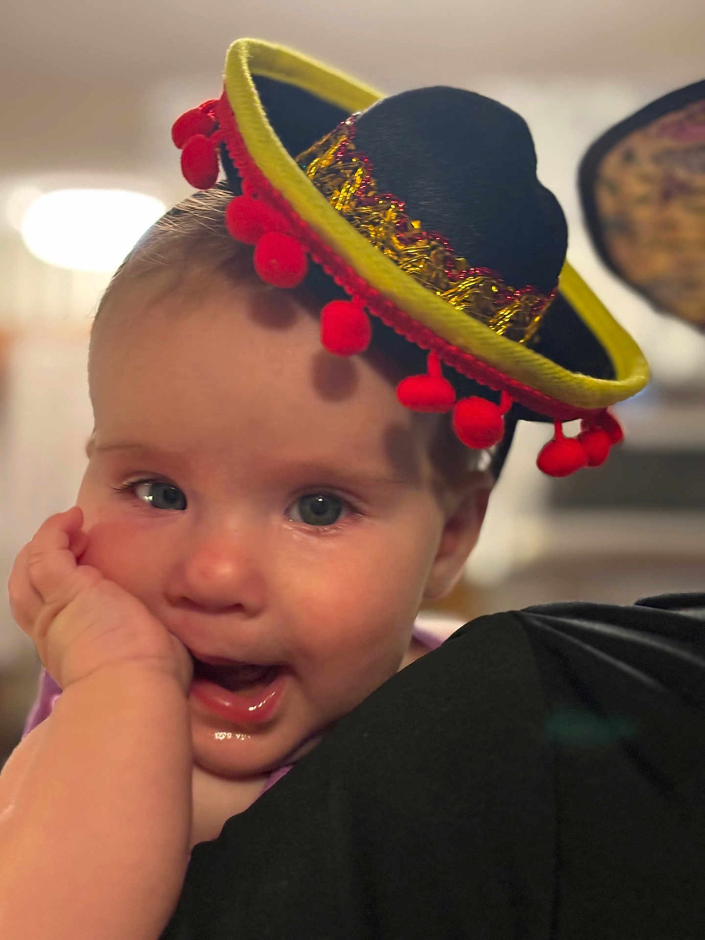 Stella joined the competition — help win amazing prizes! baby, child, face, hat, sombrero, hand, expression, cute, portrait, headwear, infant, closeup, smile, indoor, person, clothing, cheek, curious, joyful, soft_background