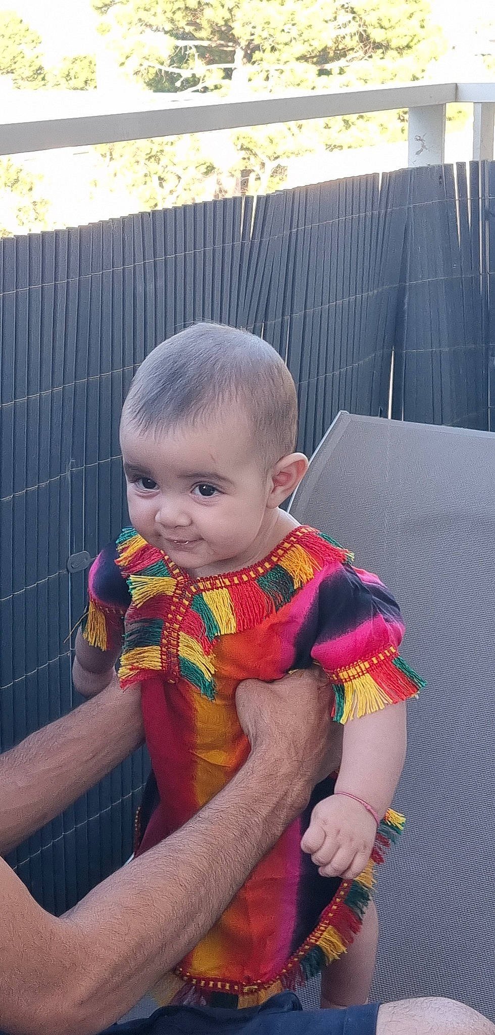 Janna a rejoint le concours — aidez-le/la à gagner de superbes lots ! baby, baby_products, baby_toddler_clothing, cheek, child, comfort, fun, grass, iris, lap, leisure, magenta, pattern, person, pink, plant, recreation, sitting, skin, textile