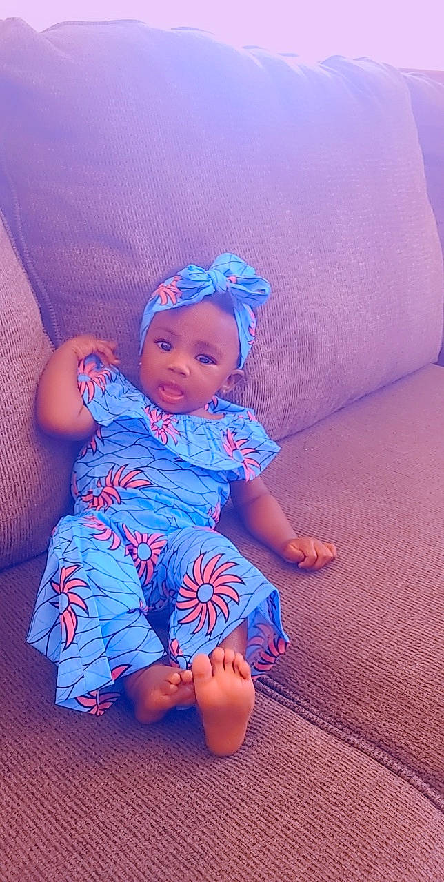 Jaylah is registered to the contest to win money with this photo: baby_toddler_clothing, blue, chin, comfort, eye, face, flash_photography, hairstyle, happy, hat, head, human_body, iris, leg, mouth, person, pink, purple, skin, smile