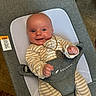 Maximus is registered to the contest to win money with this photo: baby, smiling, infant, onesie, striped_clothing, baby_seat, gray, white_mesh, gold_necklace, happy, indoors, carpet, face, portrait, cute, young_child, sitting, comfortable, human, child