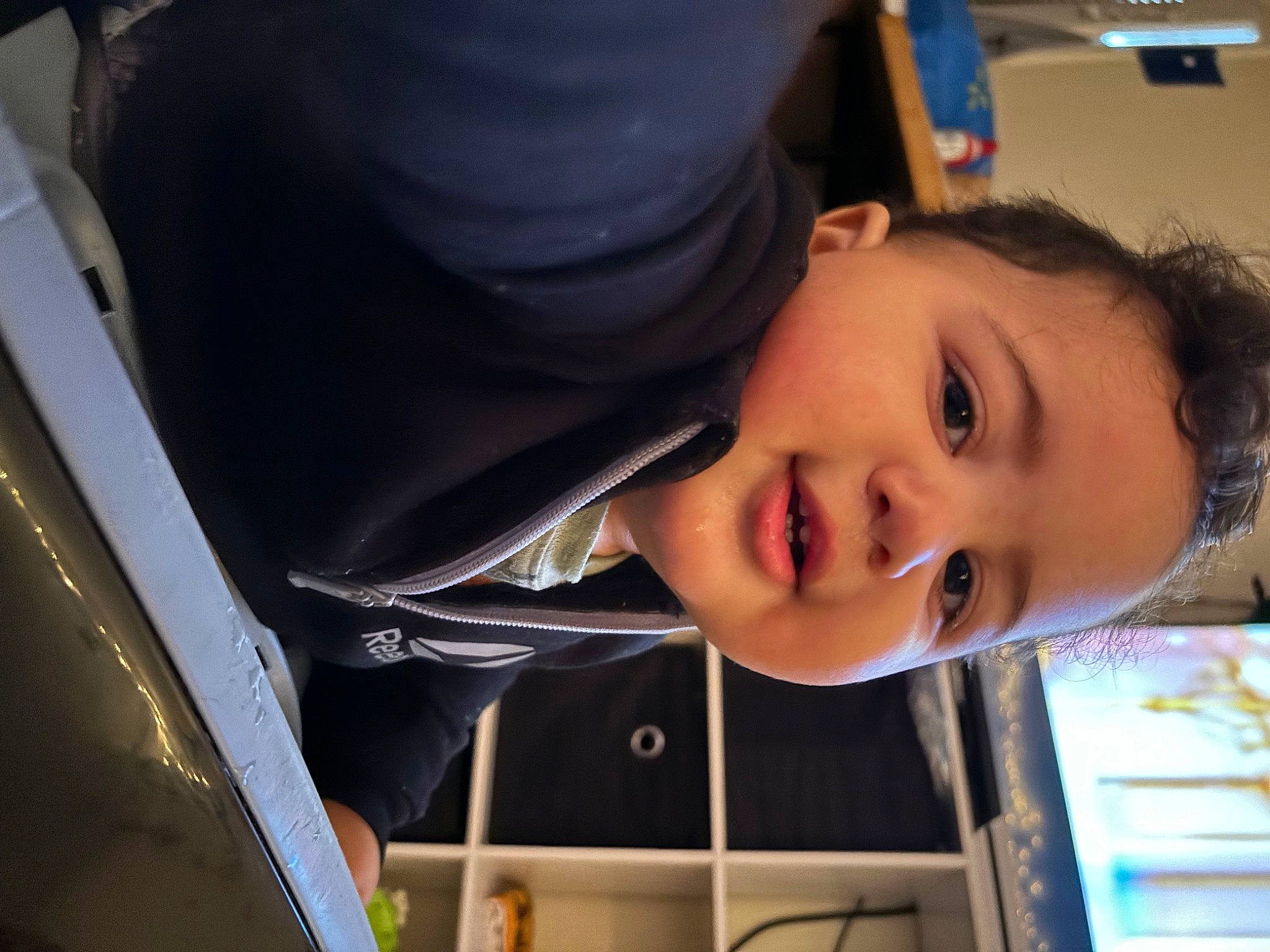 Gabriel is registered to the contest to win money with this photo: auto_part, automotive_design, automotive_lighting, black_hair, car_seat, cheek, child, eyebrow, eyelash, family_car, fun, happy, lip, mouth, nose, person, personal_luxury_car, smile, toddler, vehicle_door