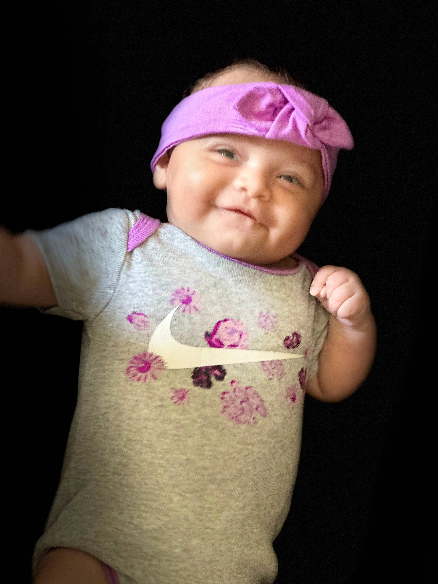 Sophia is registered to the contest to win money with this photo: baby, baby_toddler_clothing, cap, cheek, eye, eyelash, face, finger, gesture, head, headwear, joy, lip, magenta, neck, person, pink, skin, sleeve, smile