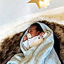 baby, blanket, pacifier, fur, star, light, sleeping, infant, cozy, soft, white_clothing, portrait, indoors, resting, newborn, cute, wrapped, peaceful, baby_boy, comfort