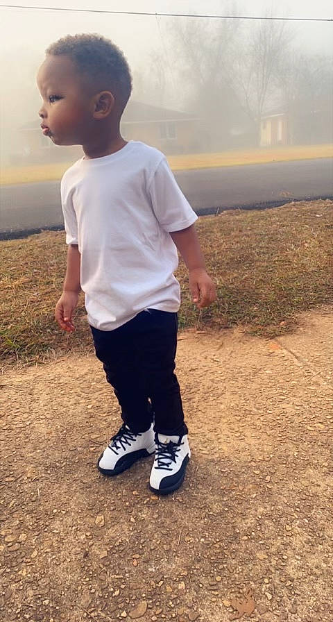 Harrison is registered to the contest to win money with this photo: asphalt, child, electric_blue, flash_photography, fun, gesture, grass, grassland, happy, head, knee, landscape, people_in_nature, person, sky, sleeve, soil, sportswear, sweatpant, t_shirt