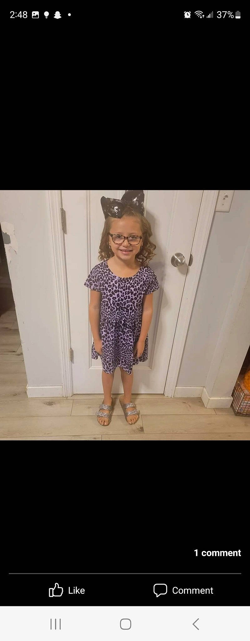 Aubry is registered to the contest to win money with this photo: baby_toddler_clothing, day_dress, door, eyewear, fashion_accessory, fashion_design, flooring, happy, hardwood, human_leg, joy, knee, magenta, metal, pattern, person, shoulder, sleeve, smile, toddler