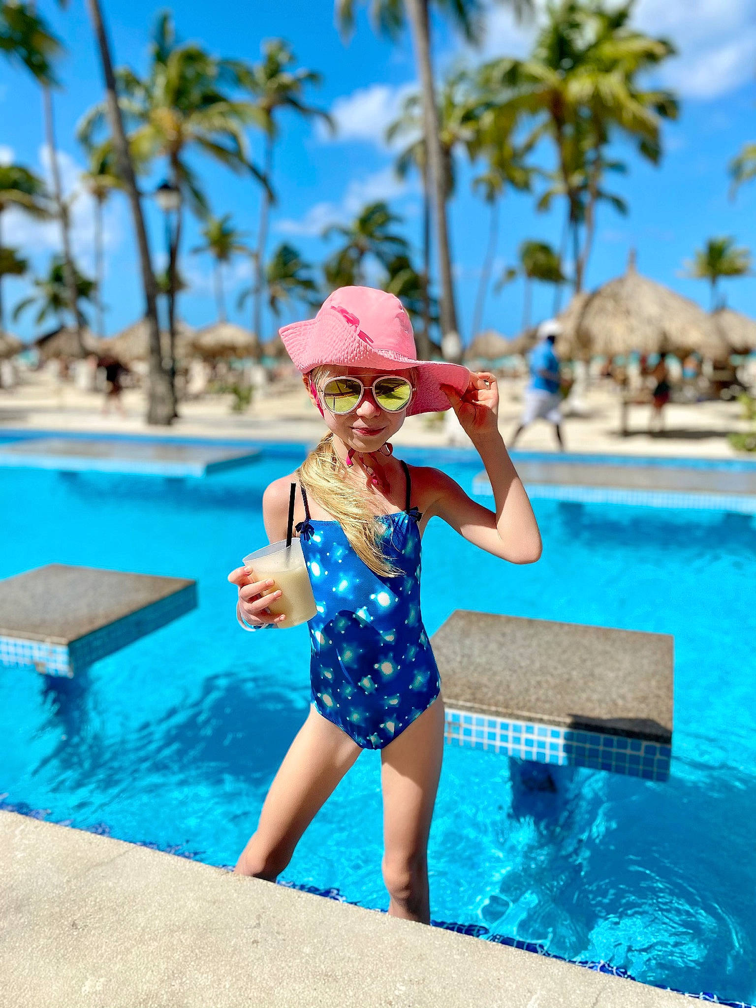 Milana is registered to the contest to win money with this photo: azure, blue, glasses, goggles, hat, headgear, headwear, leisure, leotard, maillot, one_piece_swimsuit, person, sky, summer, sunglasses, swimming_pool, swimsuit_top, swimwear, thigh, travel