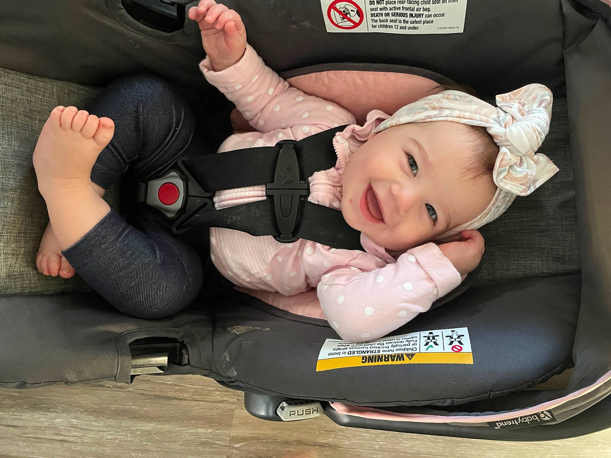 Paige is registered to the contest to win money with this photo: auto_part, baby, baby_carriage, baby_in_car_seat, baby_products, baby_toddler_clothing, car_seat, child, clothing, comfort, hand, headwear, infant_bed, joy, knee, lap, motor_vehicle, person, smile, thigh