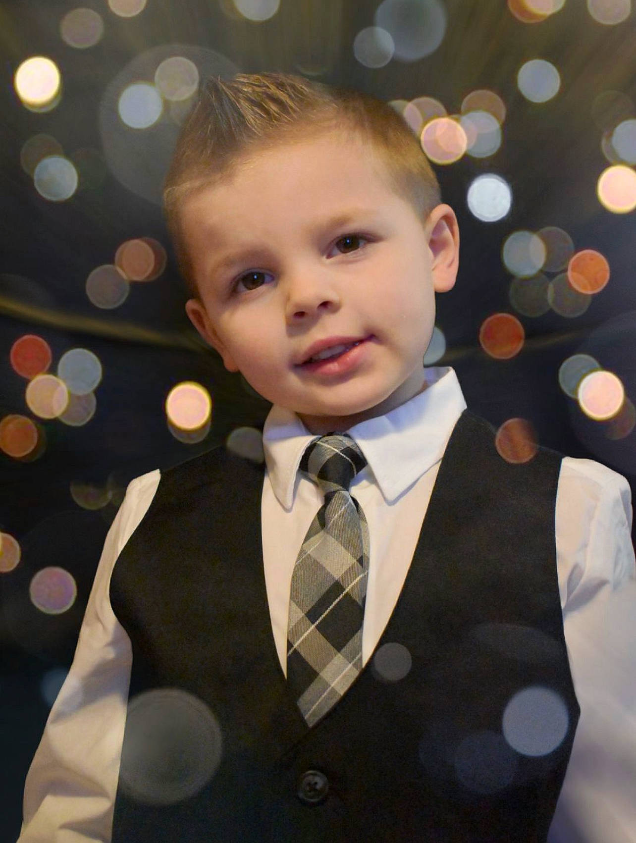 Karson joined the competition — help win amazing prizes! blazer, bow_tie, child, collar, dress_shirt, event, facial_expression, flash_photography, formal_wear, fun, hairstyle, happy, human, pattern, person, sleeve, standing, suit, tie, toddler