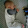 Declan is registered to the contest to win money with this photo: baby, sleeping, crib, sleep_sack, toy, stuffed_animal, infant, bed, patterned_sheet, peaceful, child, resting, indoors, cozy, young_child, sleep, cute, soft_lighting, quiet, nursery