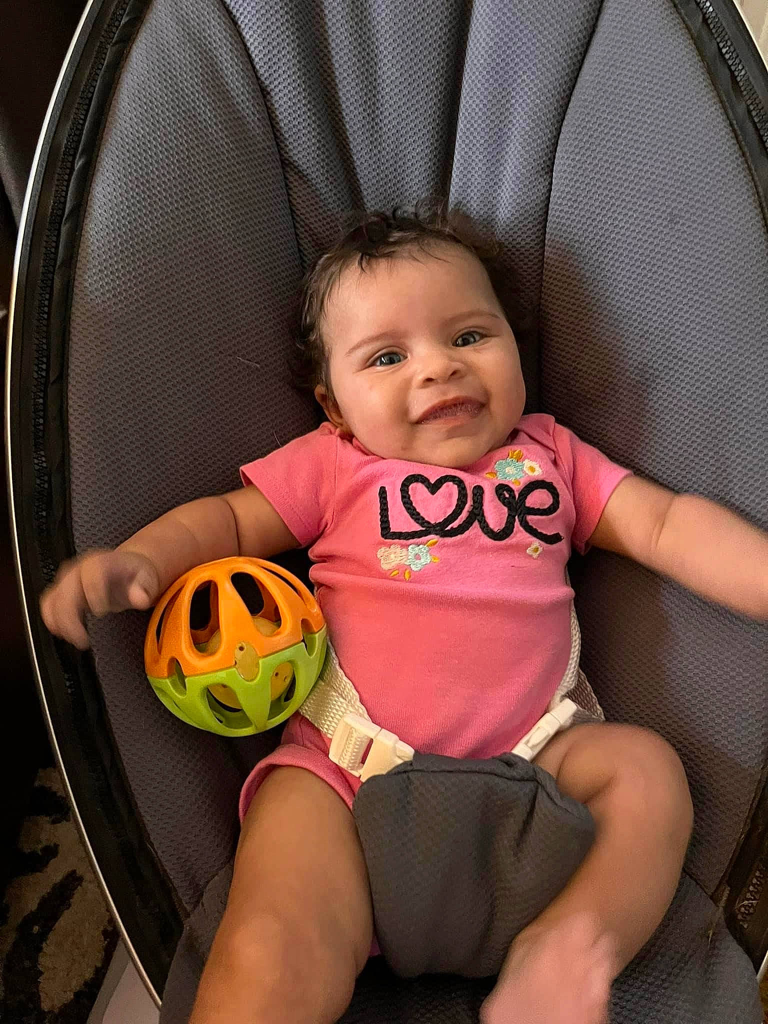Myka is registered to the contest to win money with this photo: arm, baby, baby_products, baby_toddler_clothing, ball, chair, child, comfort, football, fun, happy, human_leg, joy, leg, organ, pattern, person, personal_protective_equipment, sitting, smile