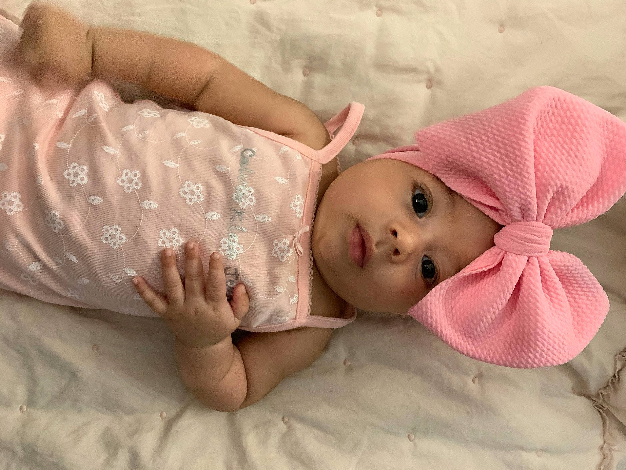 Abilene is registered to the contest to win money with this photo: baby, child, hand, headwear, person, pink, skin, toddler