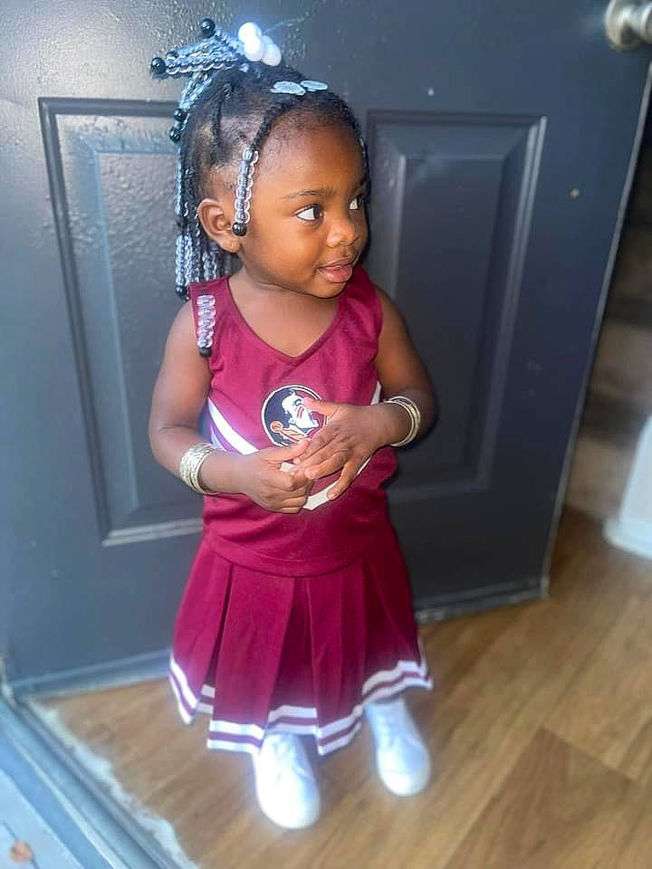 Aviana is registered to the contest to win money with this photo: audio_equipment, baby_toddler_clothing, black_hair, child, event, fashion_accessory, flooring, fun, happy, hardwood, human_leg, jewellery, laminate_flooring, magenta, person, purple, room, sock, thigh, toddler