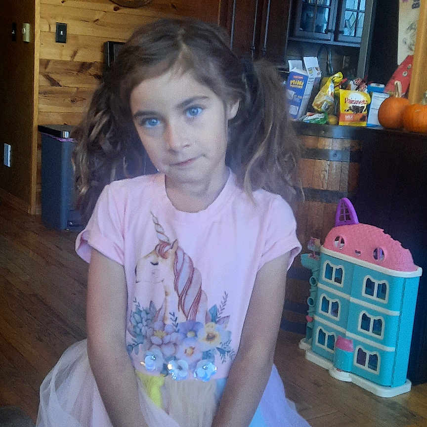 Kaylani is registered to the contest to win money with this photo: cabinet, child, closet, clothing, cupboard, dress, face, female, food, furniture, girl, hardwood, head, person, photography, plywood, portrait, sweets, t_shirt, wood