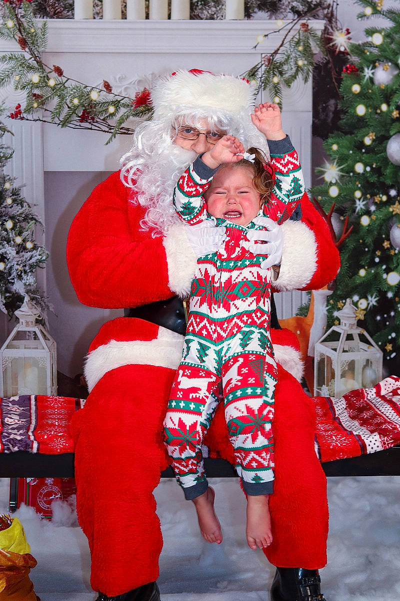Laina joined the competition — help win amazing prizes! child, christmas, christmas_decoration, christmas_eve, christmas_ornament, christmas_tree, event, fun, happy, hat, holiday, holiday_ornament, human_body, lap, leg, person, red, santa_claus, smile, standing