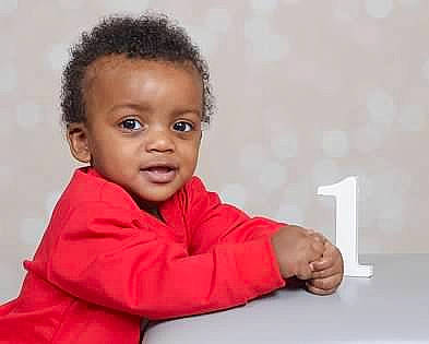 Princeton is registered to the contest to win money with this photo: baby, baby_toddler_clothing, cheek, child, comfort, fun, gesture, happy, person, room, sitting, sleeve, smile, thumb, toddler