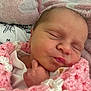 Robyn is registered to the contest to win money with this photo: newborn, baby, infant, sleeping, blanket, crochet, pink, white, closeup, face, hand, skin, peaceful, resting, indoors, soft, cute, portrait, child, toddler