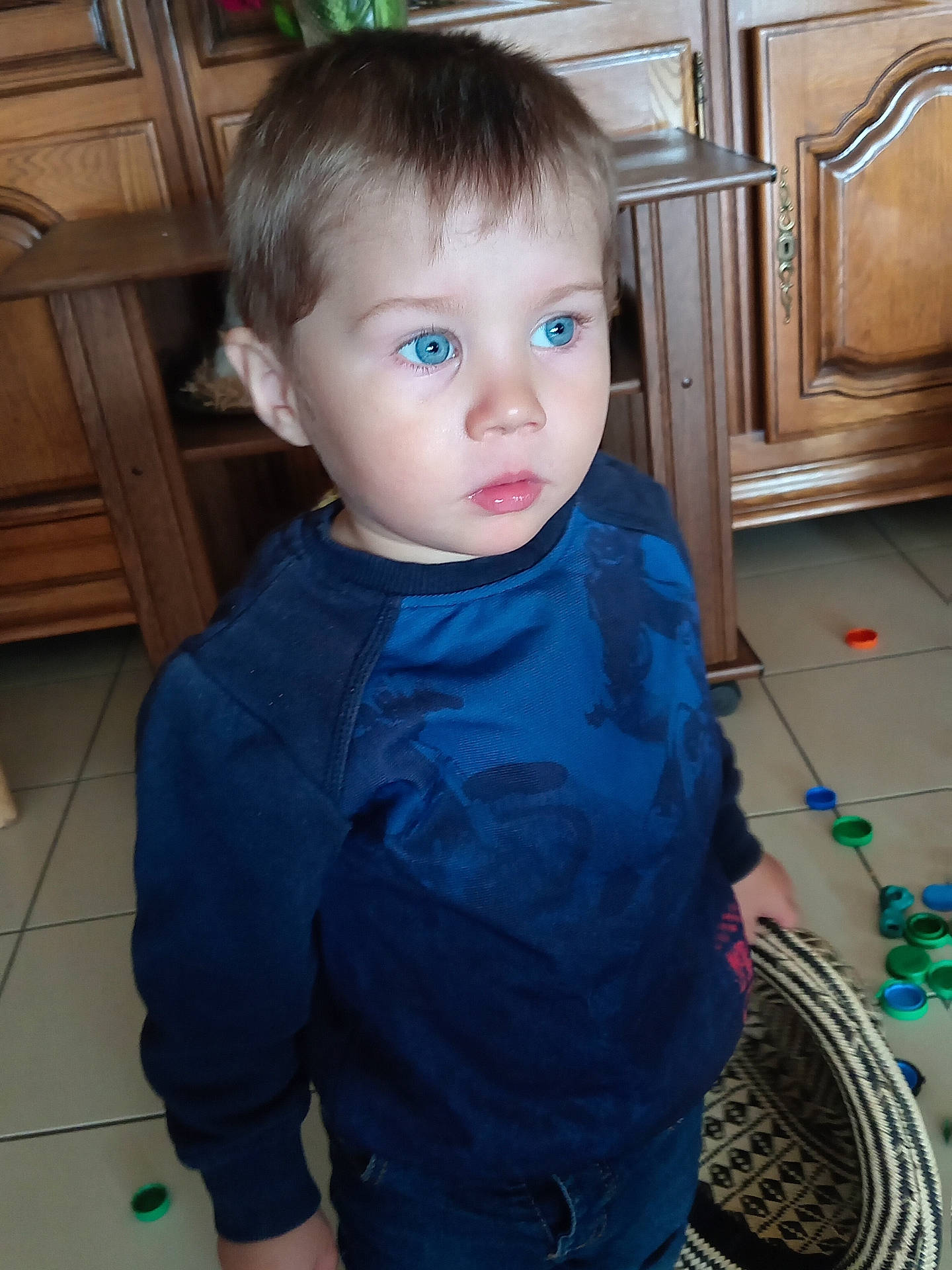 baby, bodypart, cabinet, closet, clothing, cupboard, face, finger, furniture, hand, hardwood, head, longsleeve, pants, person, photography, plywood, portrait, sleeve, wood